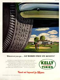 Vintage Kelly Tires advertisement featuring a classic car tire and a scenic park background, highlighting historical automotive advertising.